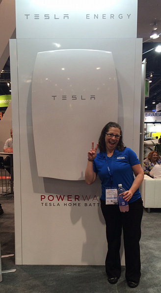 Me, standing next to the Tesla Powerwall %u2013 definitely not a 1-person carry piece of equipment.