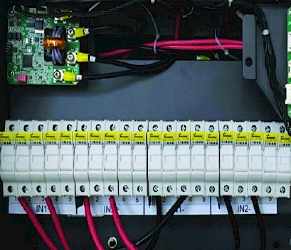 To facilitate cooling and prevent overheating, manufacturers may recommend alternating input conductors, as shown here, so that every other fuseholder has a 30 A fuse and the rest of the inputs remain unused, with the fuses removed.